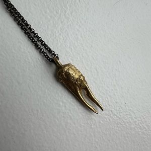 Gold necklace with crawfish claw pendant